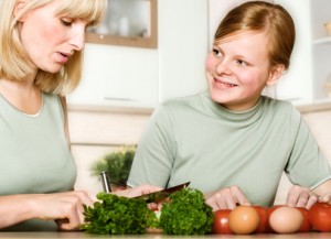 Mother and daughter cook food